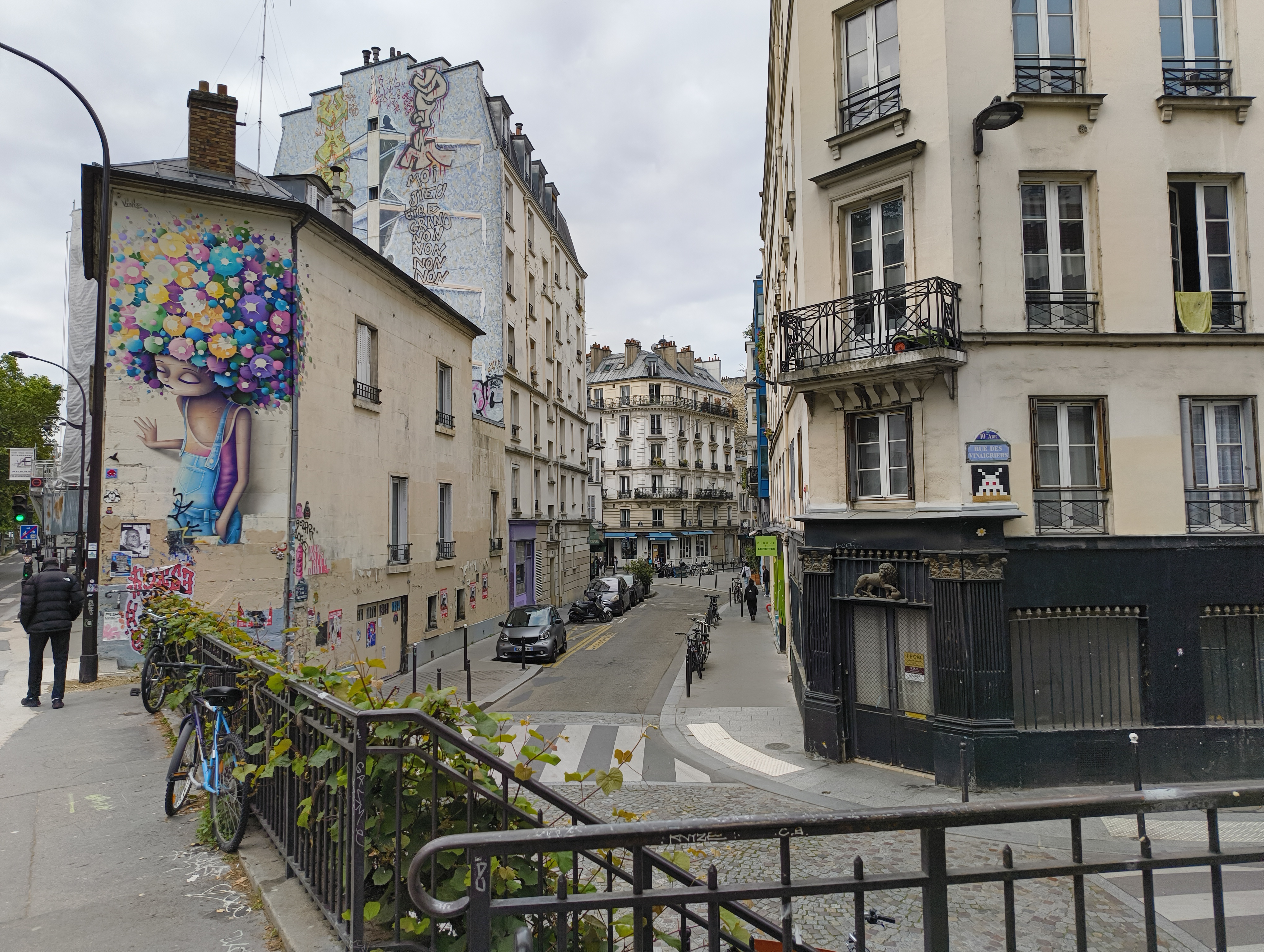 A street mural seen from a small bridge in the 10th arrondissement of Paris on the morning walk back from the Gare de l'Est, photographed 21 May 2026